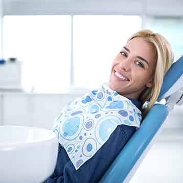 Smiling woman sitting in dental office