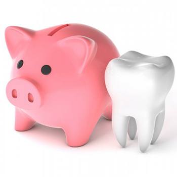 a piggy bank next to a tooth 