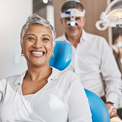 a patient smiling after visiting her dentist