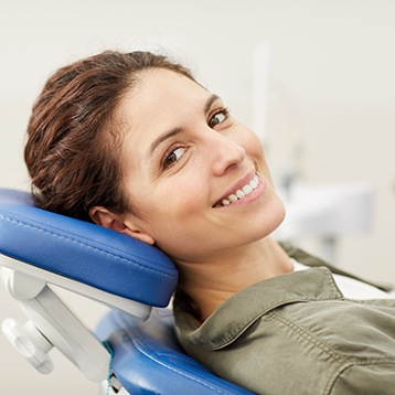 a patient smiling at their dentist